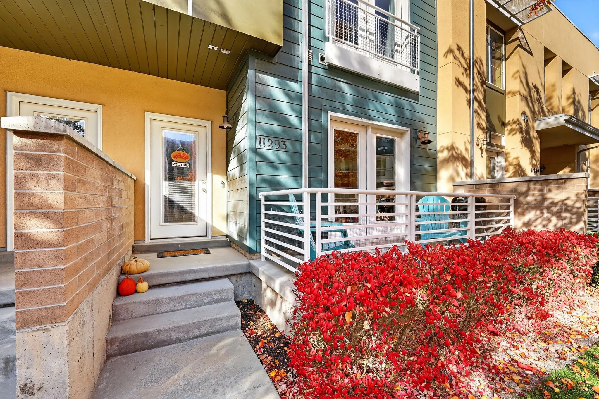Doorway to property featuring stucco siding