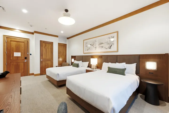 Recessed lighting, wood-finish doors, carpeted flooring, and wall-mounted light fixtures
