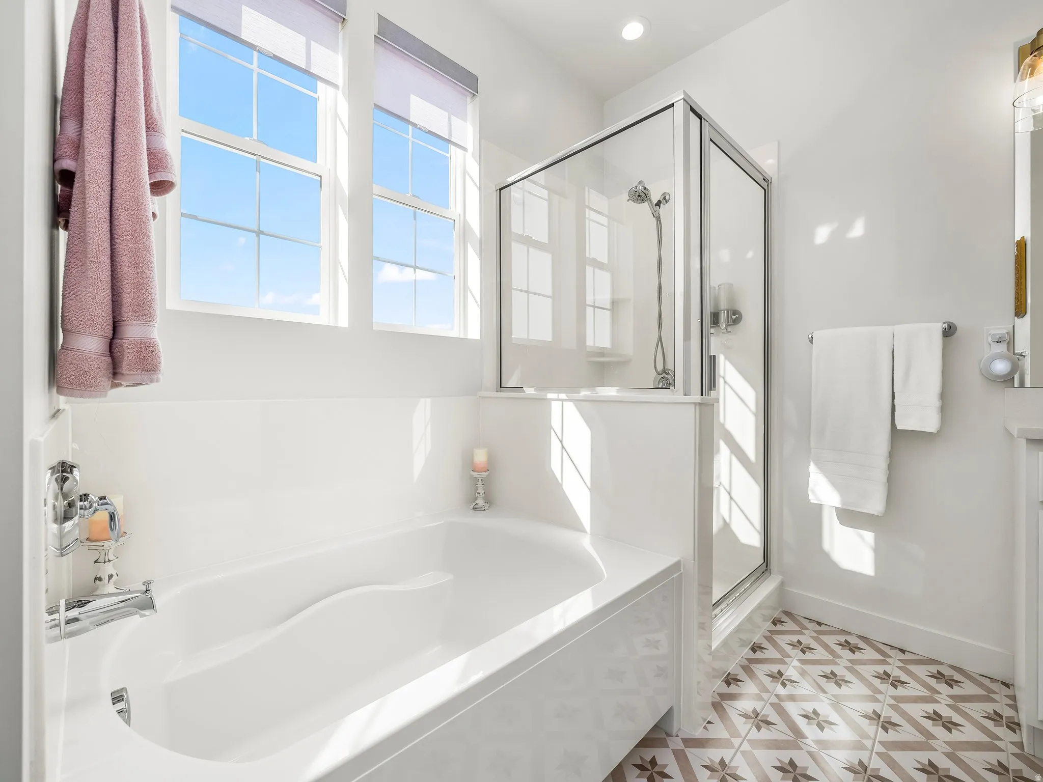 Full bath with a stall shower, a bath, and vanity