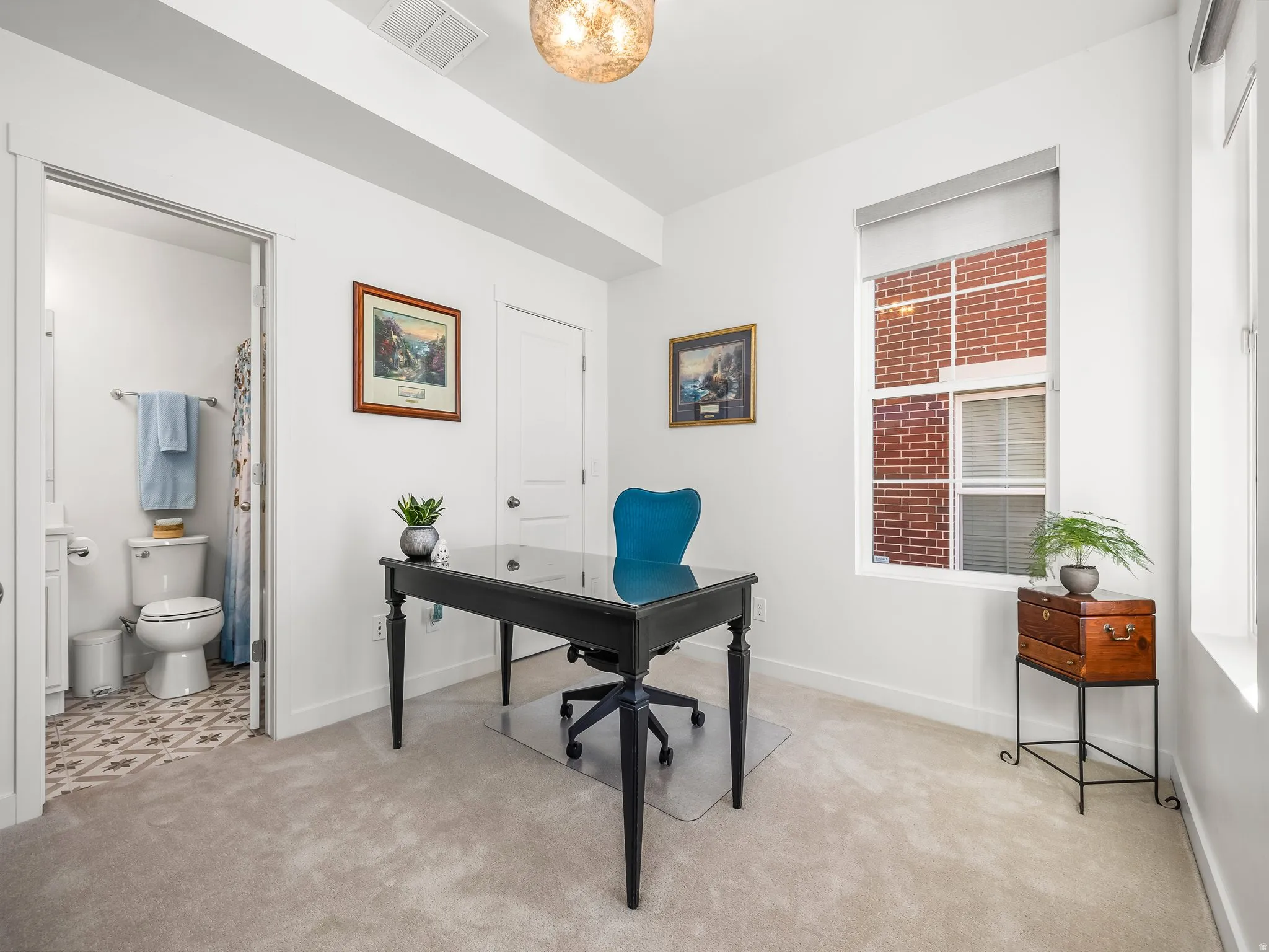 Office area with light carpet and baseboards