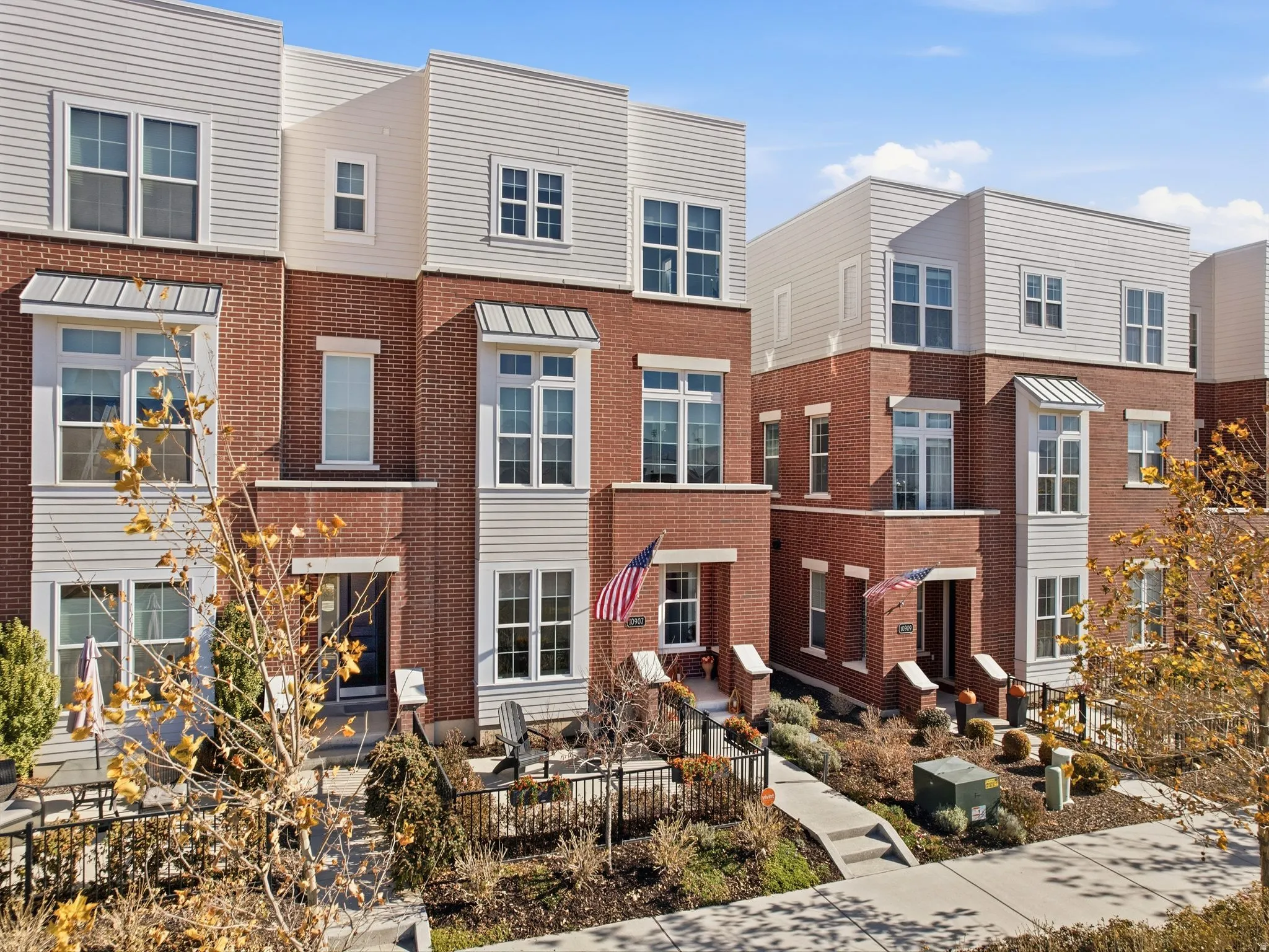 Contemporary house featuring a residential view and brick siding