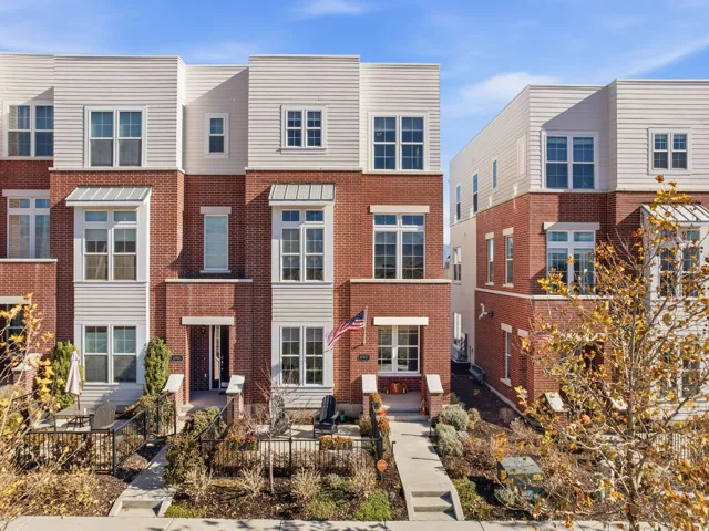 Contemporary house featuring a residential view and brick siding