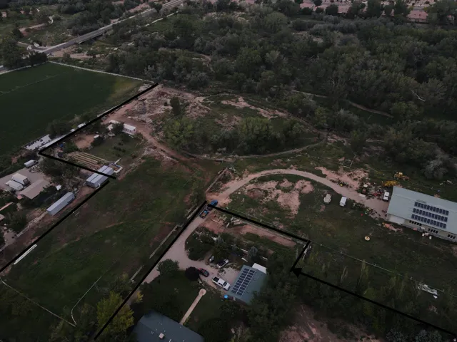 Aerial overview of property's location with property parcel outlined