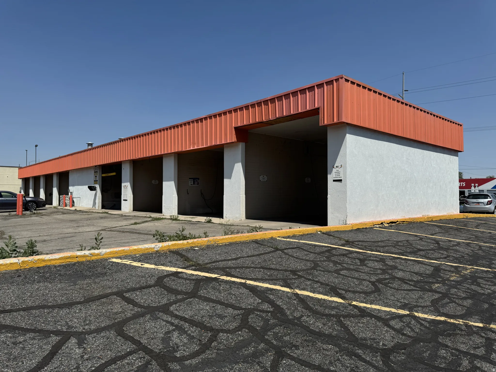 View of commercial location with uncovered parking