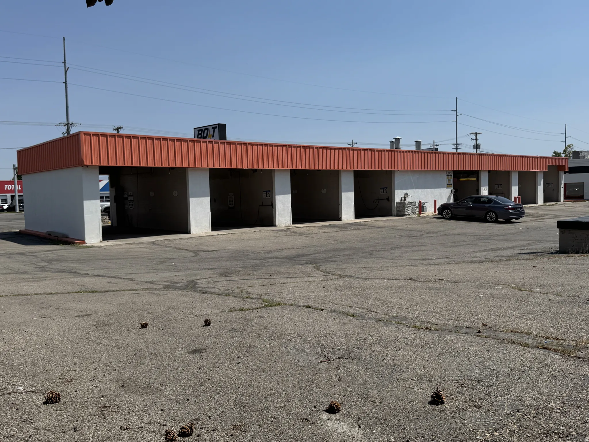 View of property featuring uncovered parking