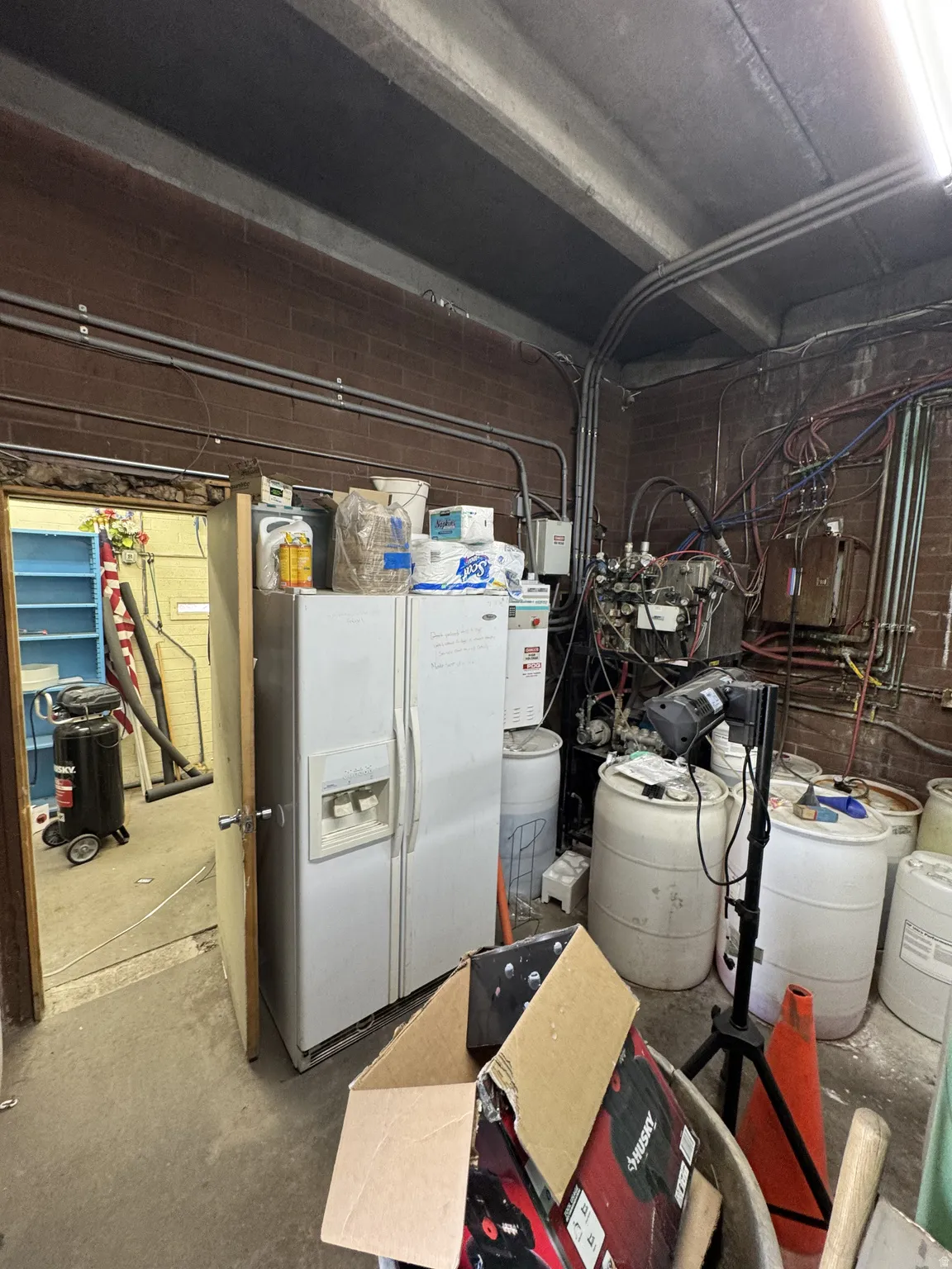 Bwhite fridge with ice dispenser and a water softener