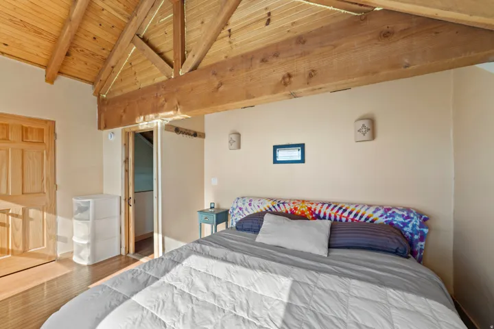 Bedroom with wood finished floors and wooden ceiling