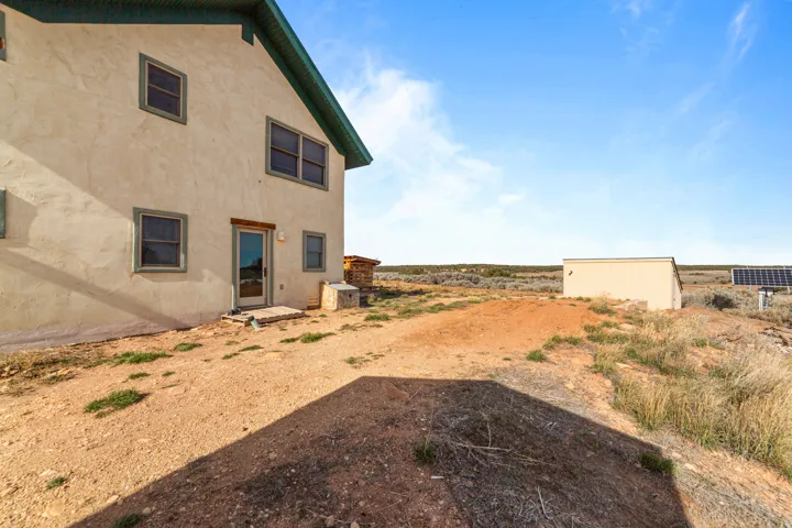 View of side yard near water cistern shed