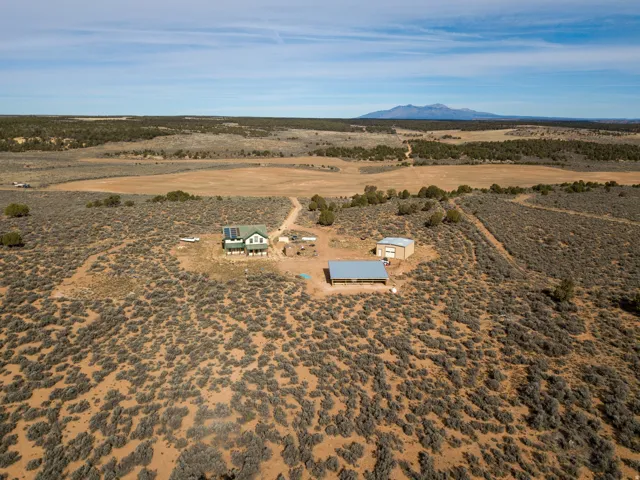 Overview of rural landscape with a desert landscape and a mountain backdrop