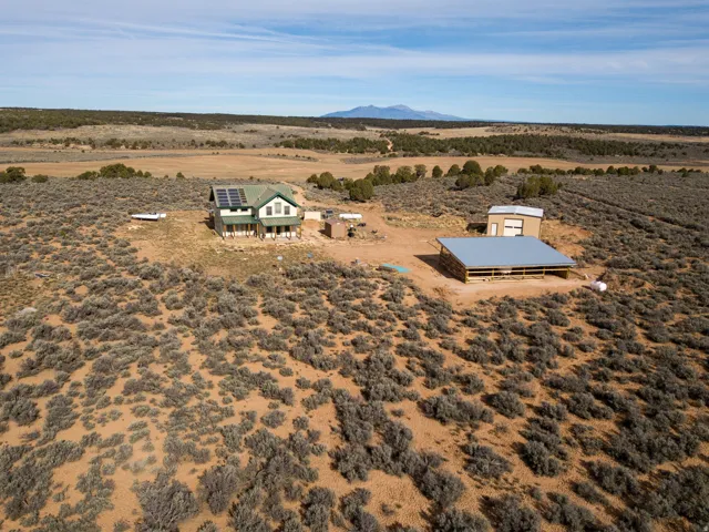 View of rural area featuring a desert landscape and a mountain backdrop