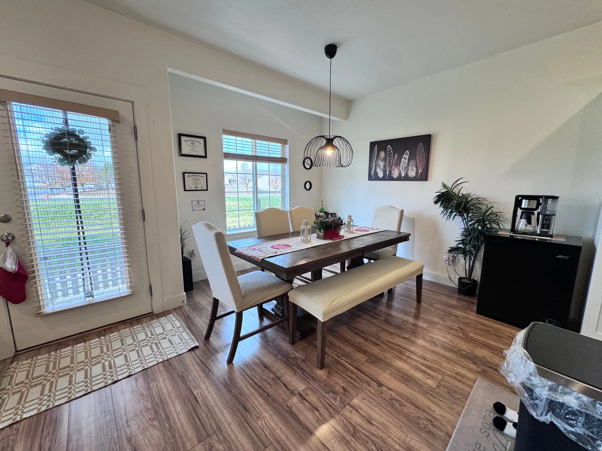Dining room featuring dark wood-type flooring and baseboards