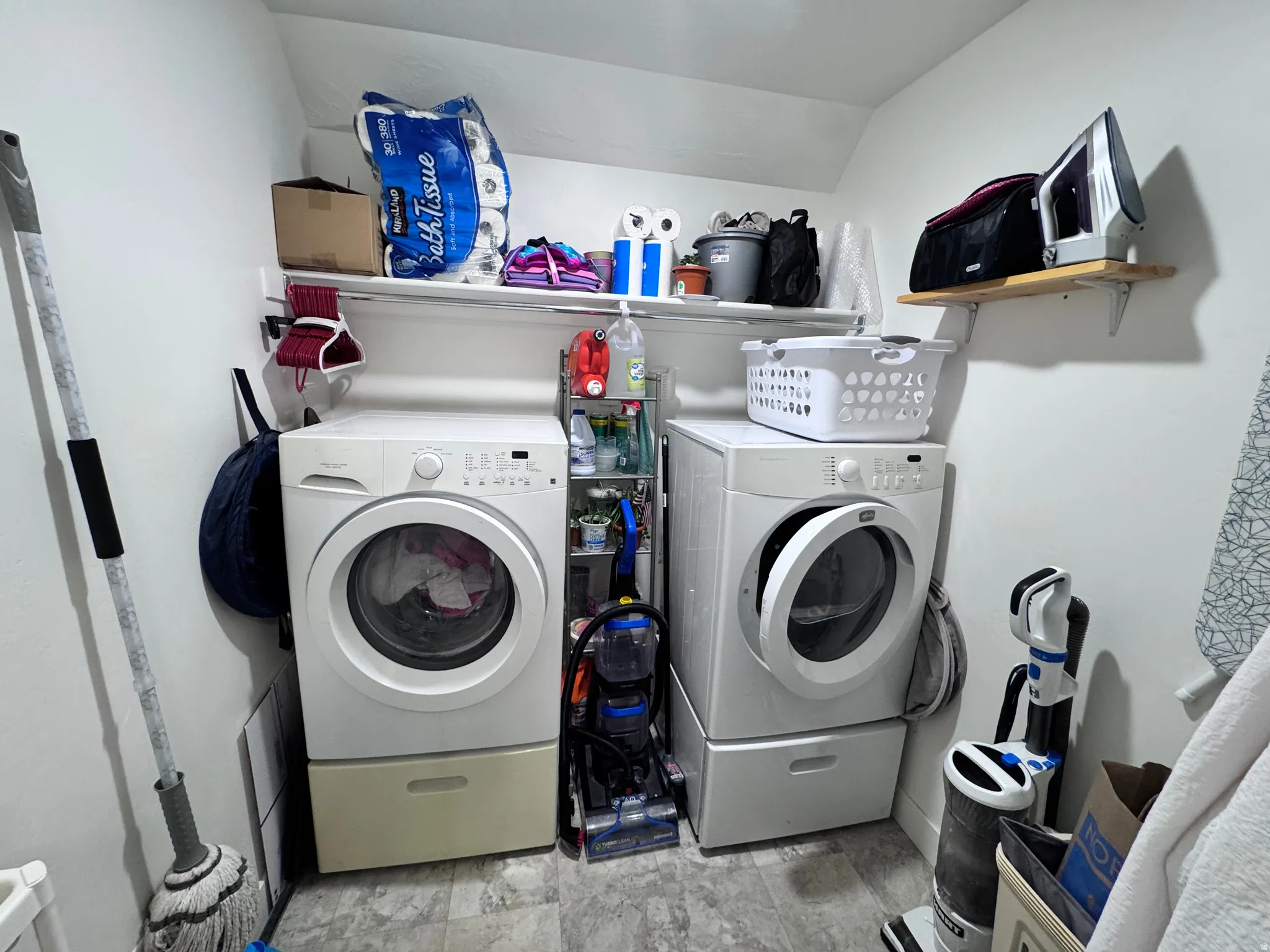 Laundry area featuring washing machine and clothes dryer