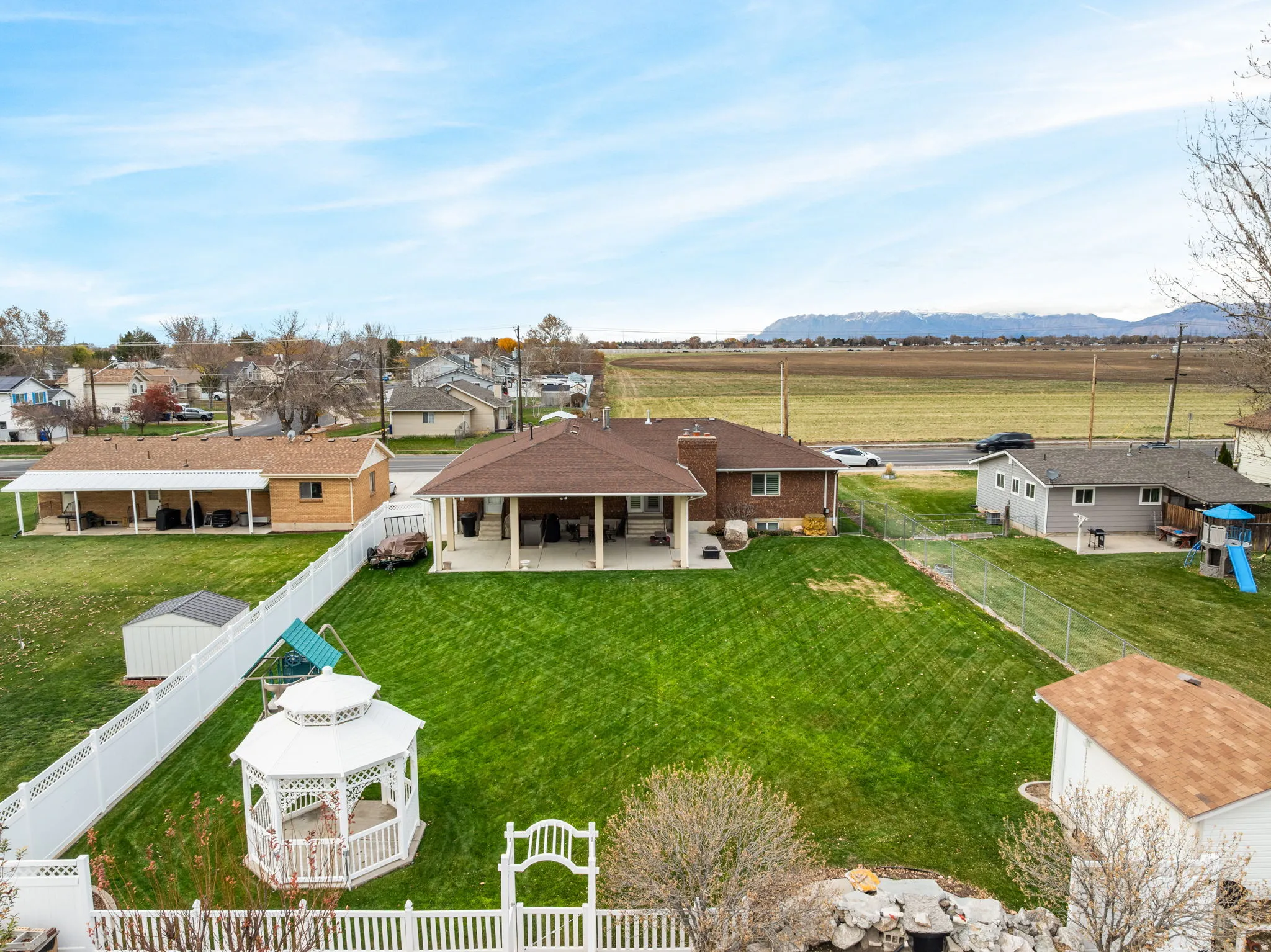 Overview of rural landscape featuring nearby suburban area