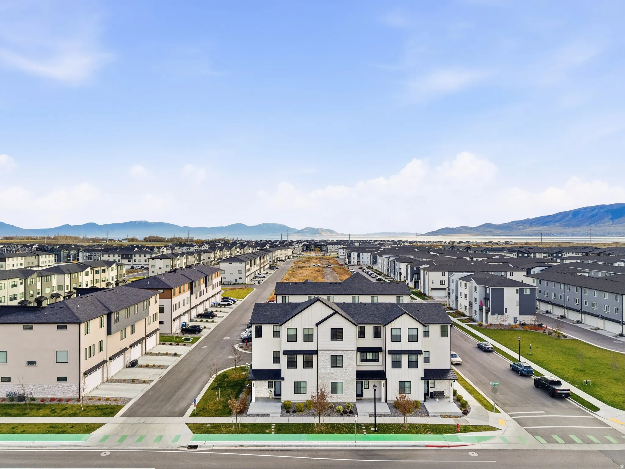 Aerial view of residential area featuring a mountain backdrop