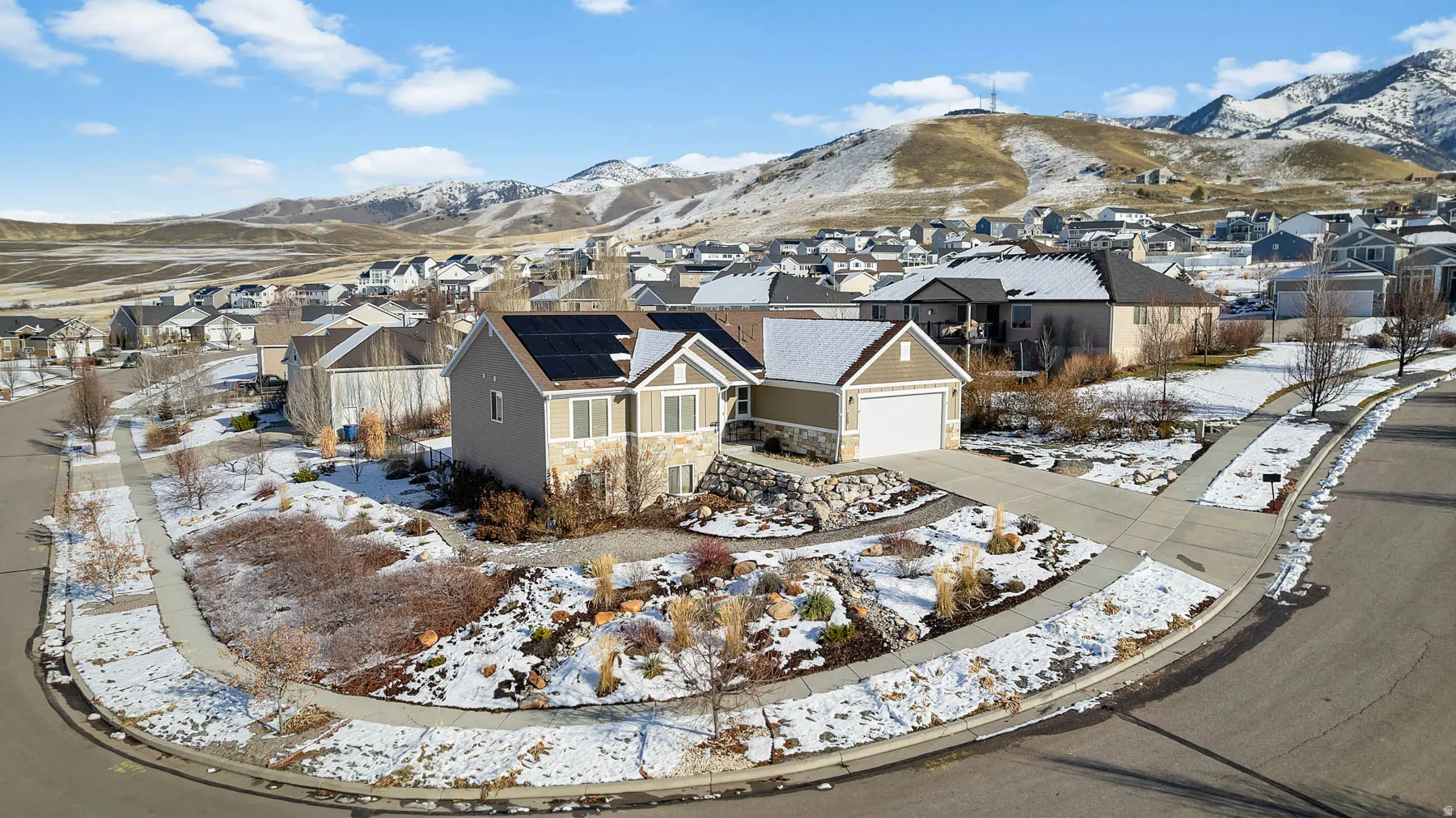 Snowy aerial view with a residential view and a mountain view