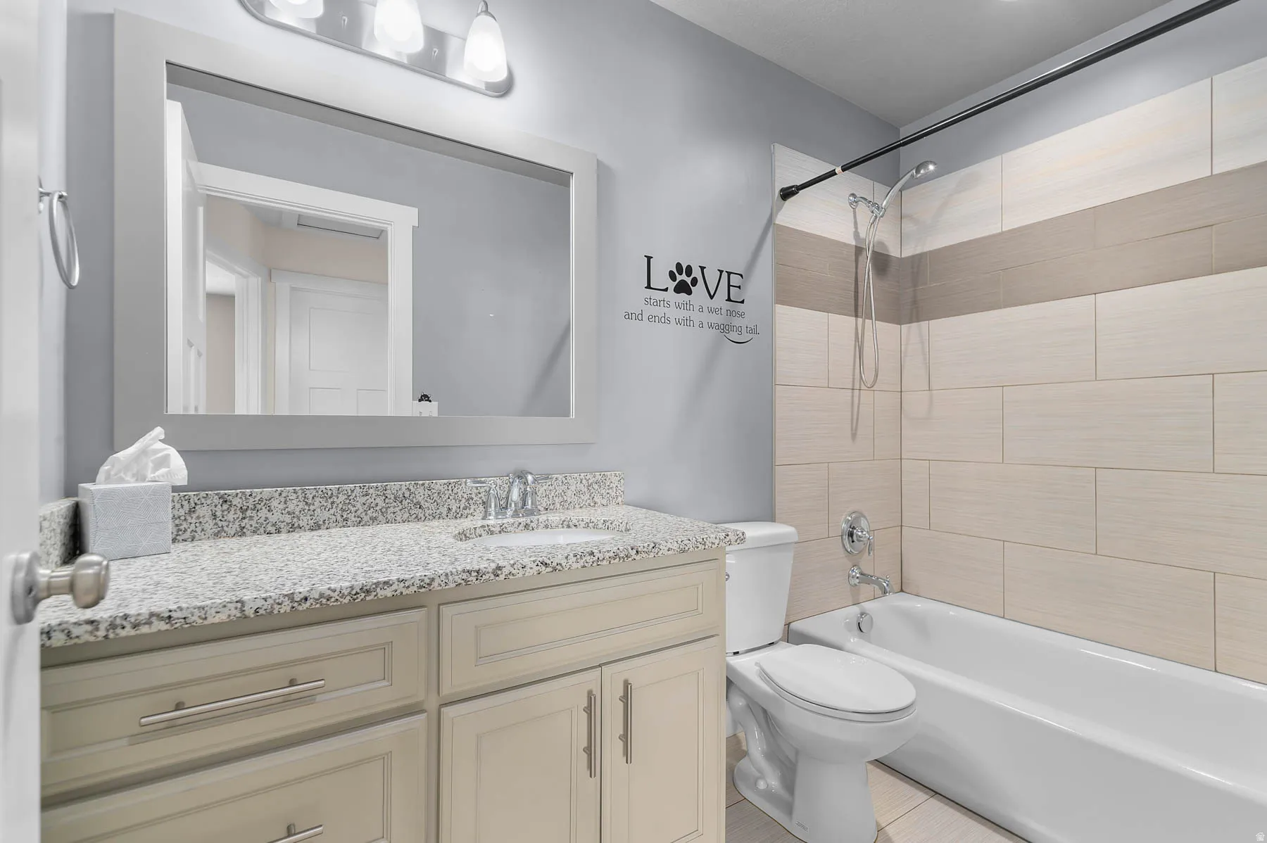 Full bathroom with vanity and tub / shower combination