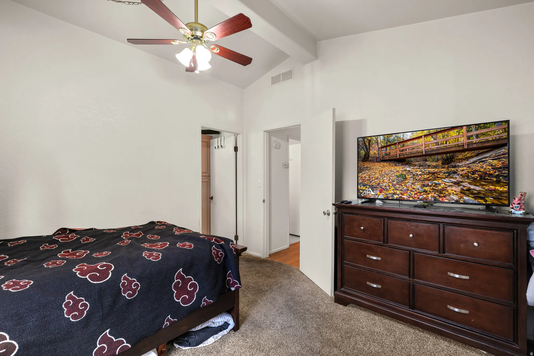 Bedroom featuring light carpet and ceiling fan