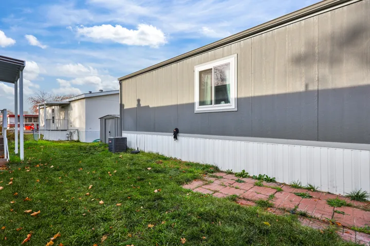 View of home's exterior with a cooling unit