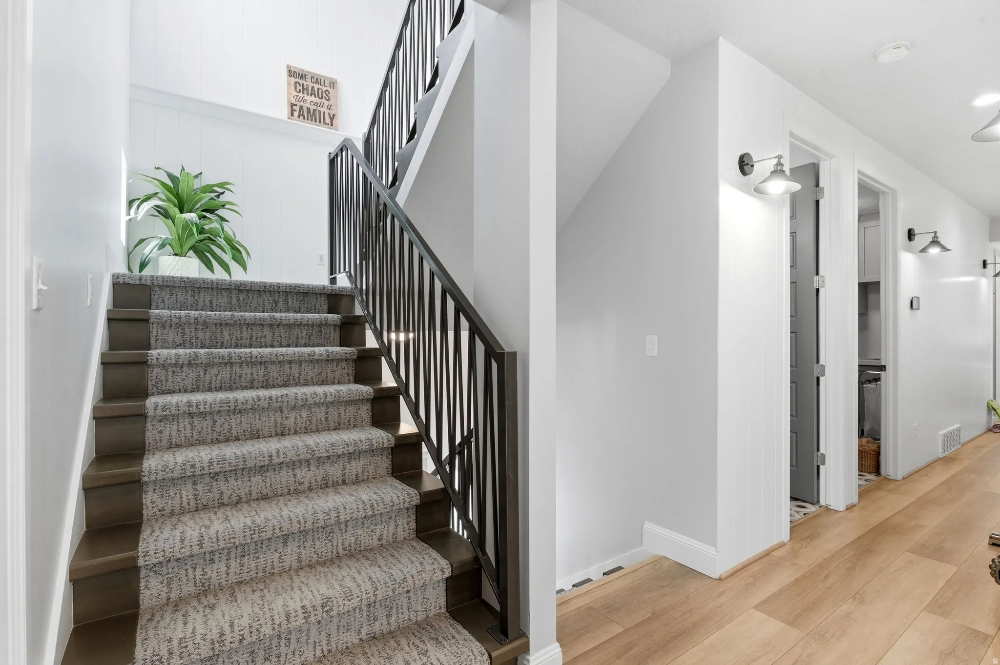 Stairway featuring wood finished floors and baseboards