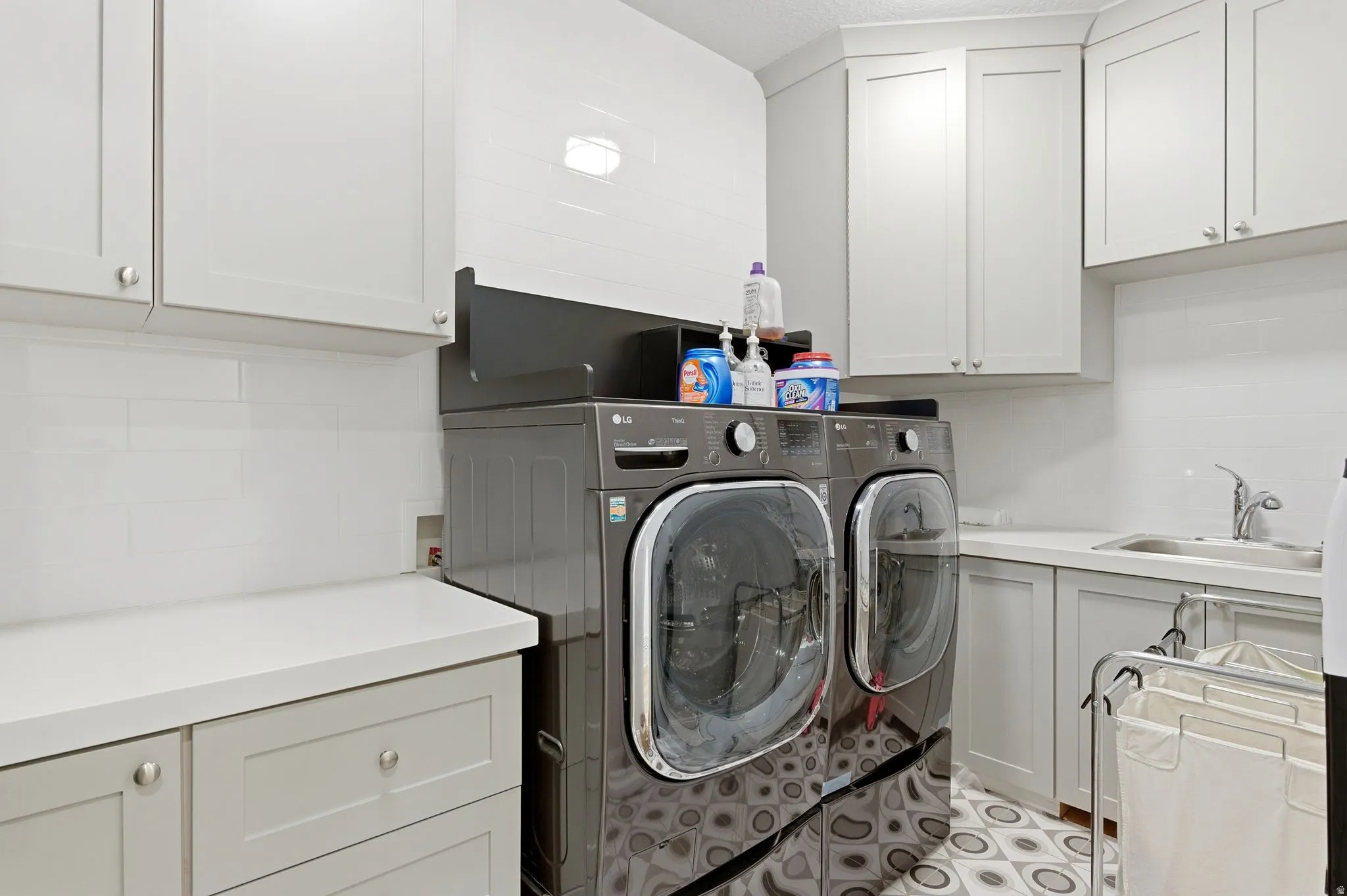 Laundry area featuring cabinet space and independent washer and dryer