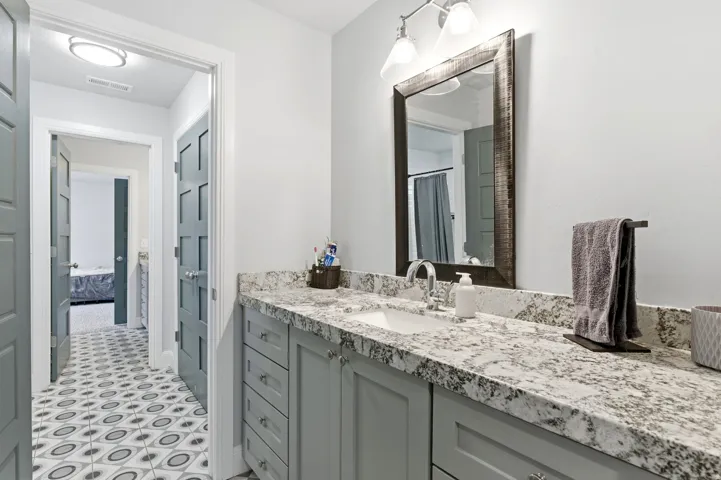 Ensuite bathroom featuring vanity and a shower with shower curtain