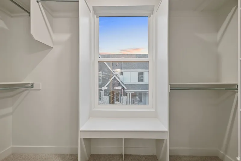 Walk in closet featuring carpet floors