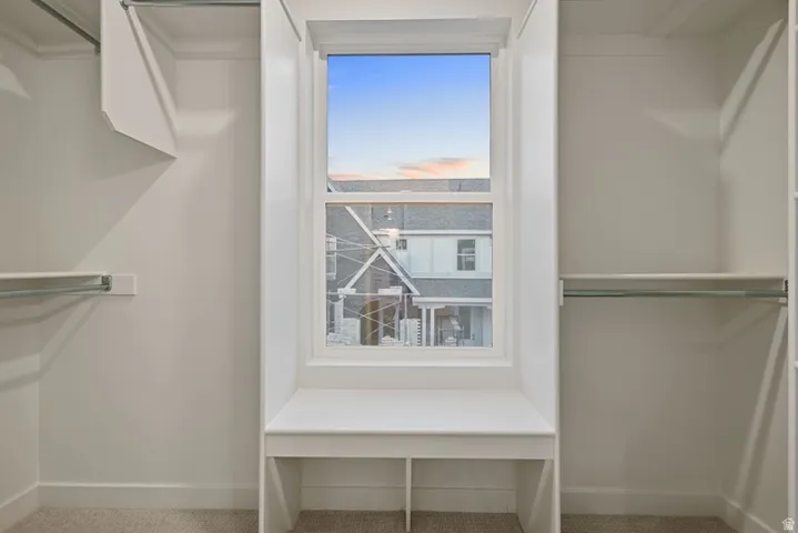 Walk in closet featuring carpet floors