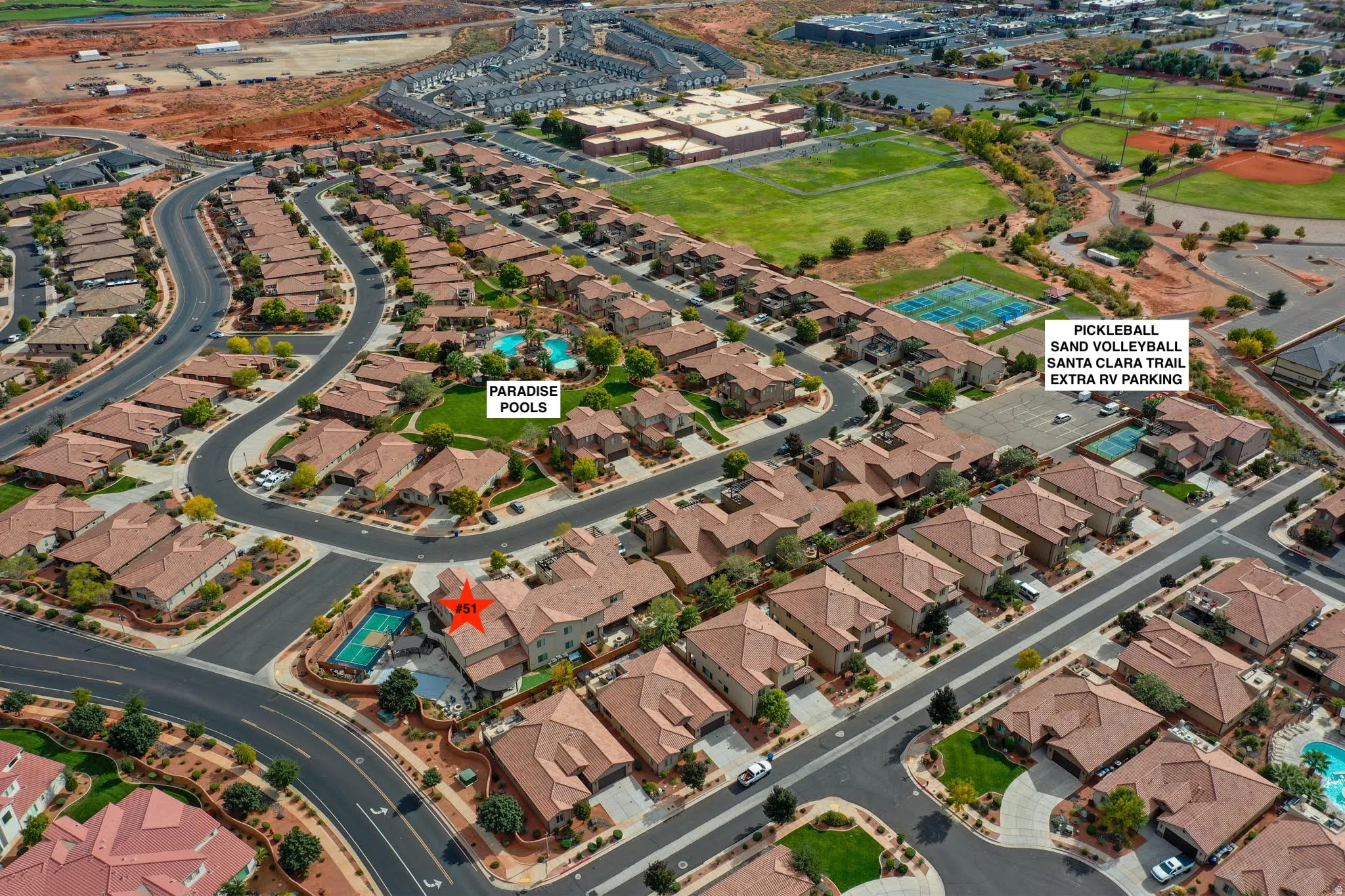 Aerial view of property's location with nearby suburban area