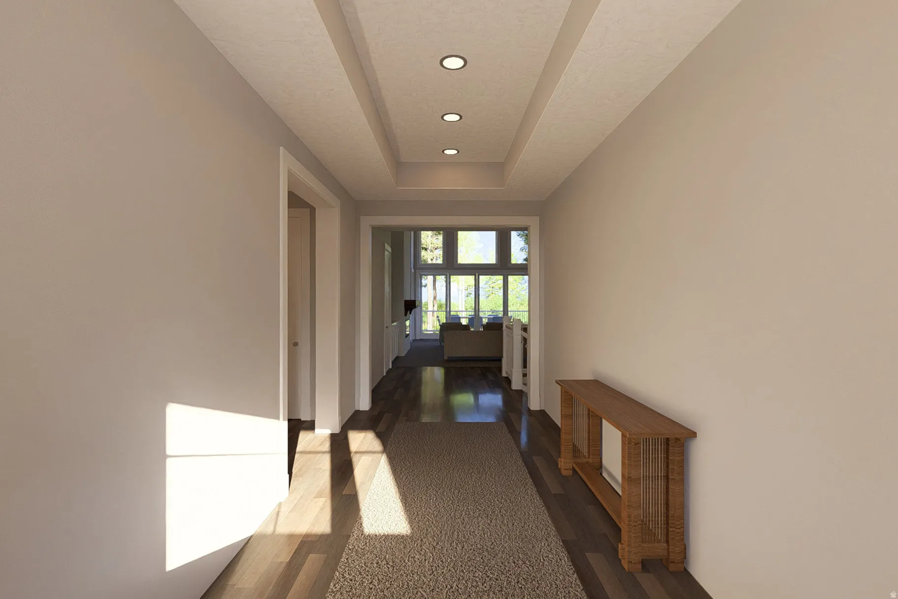 Hallway featuring recessed ceiling lighting, tray ceiling detail, wood-finish flooring, and light-toned wall finishes