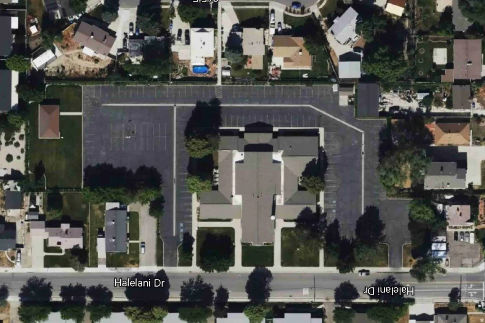 Aerial overview of property's location with nearby suburban area