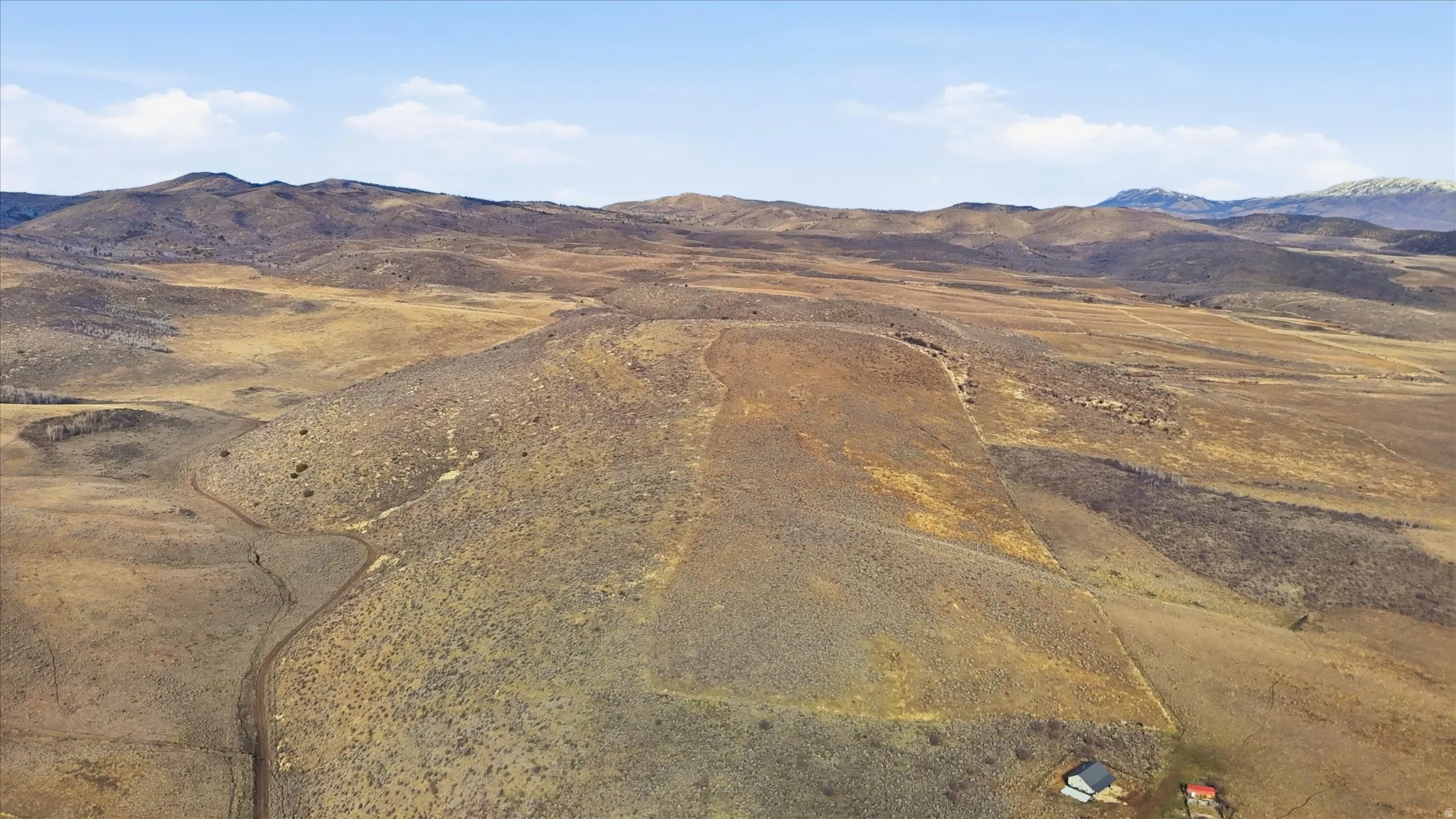 View of mountain background featuring rural landscape
