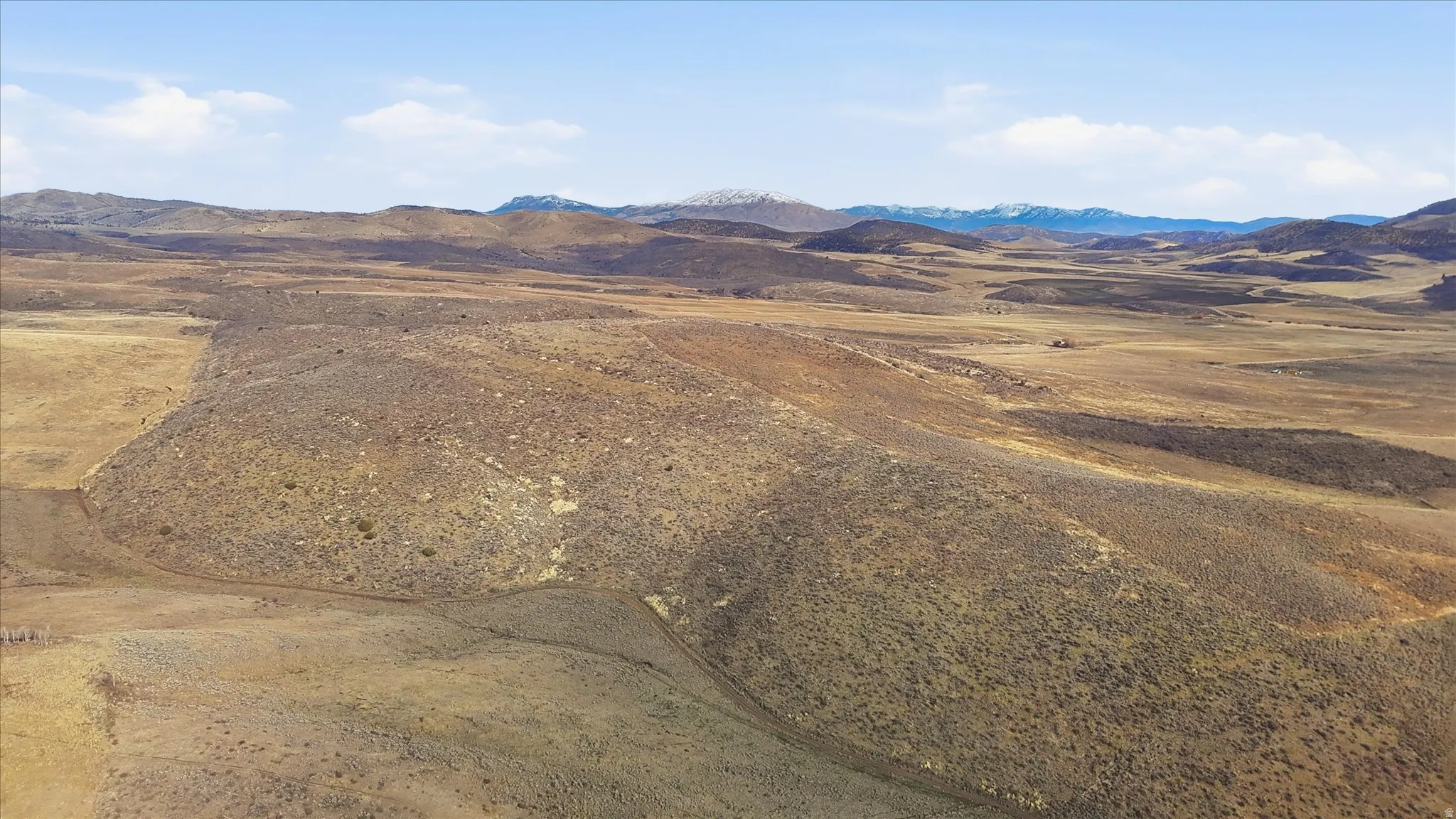 View of mountain backdrop featuring rural landscape and a desert landscape