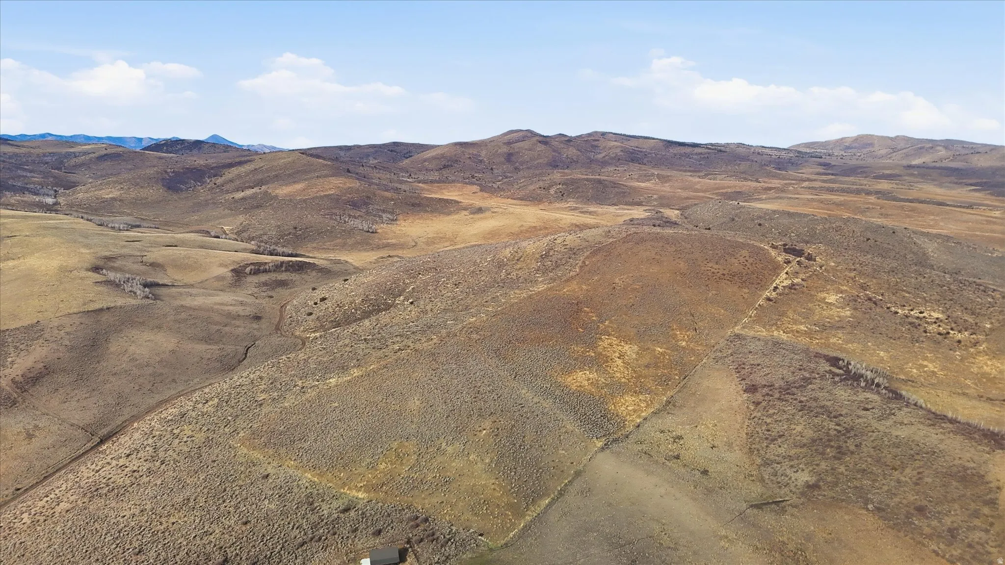 View of mountain backdrop featuring rural landscape