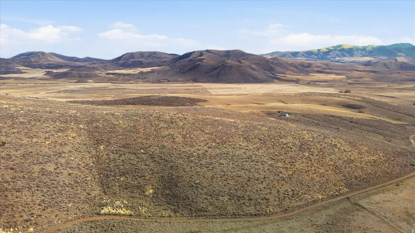 View of mountain backdrop featuring rural landscape
