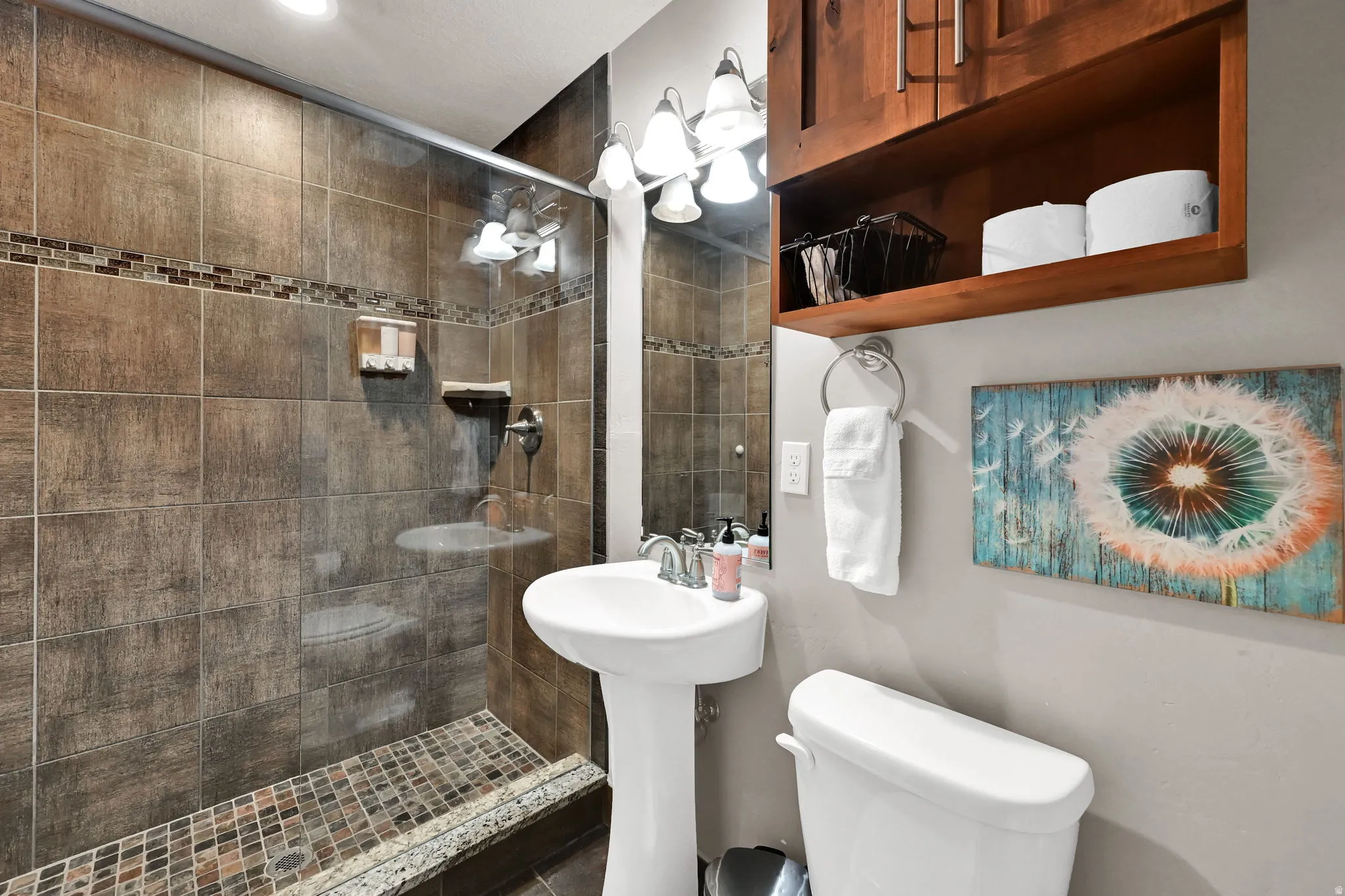 Bathroom with toilet and a tile shower