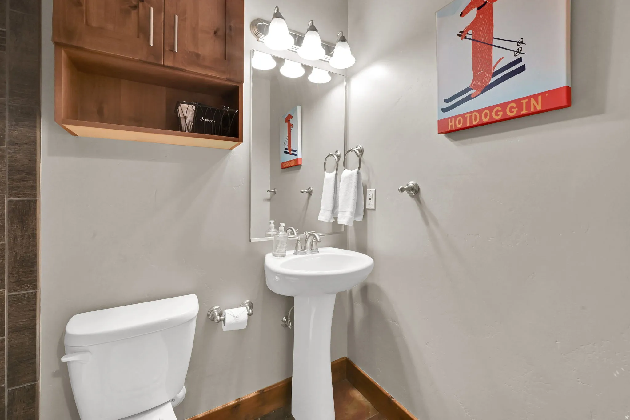 Bathroom with toilet and baseboards