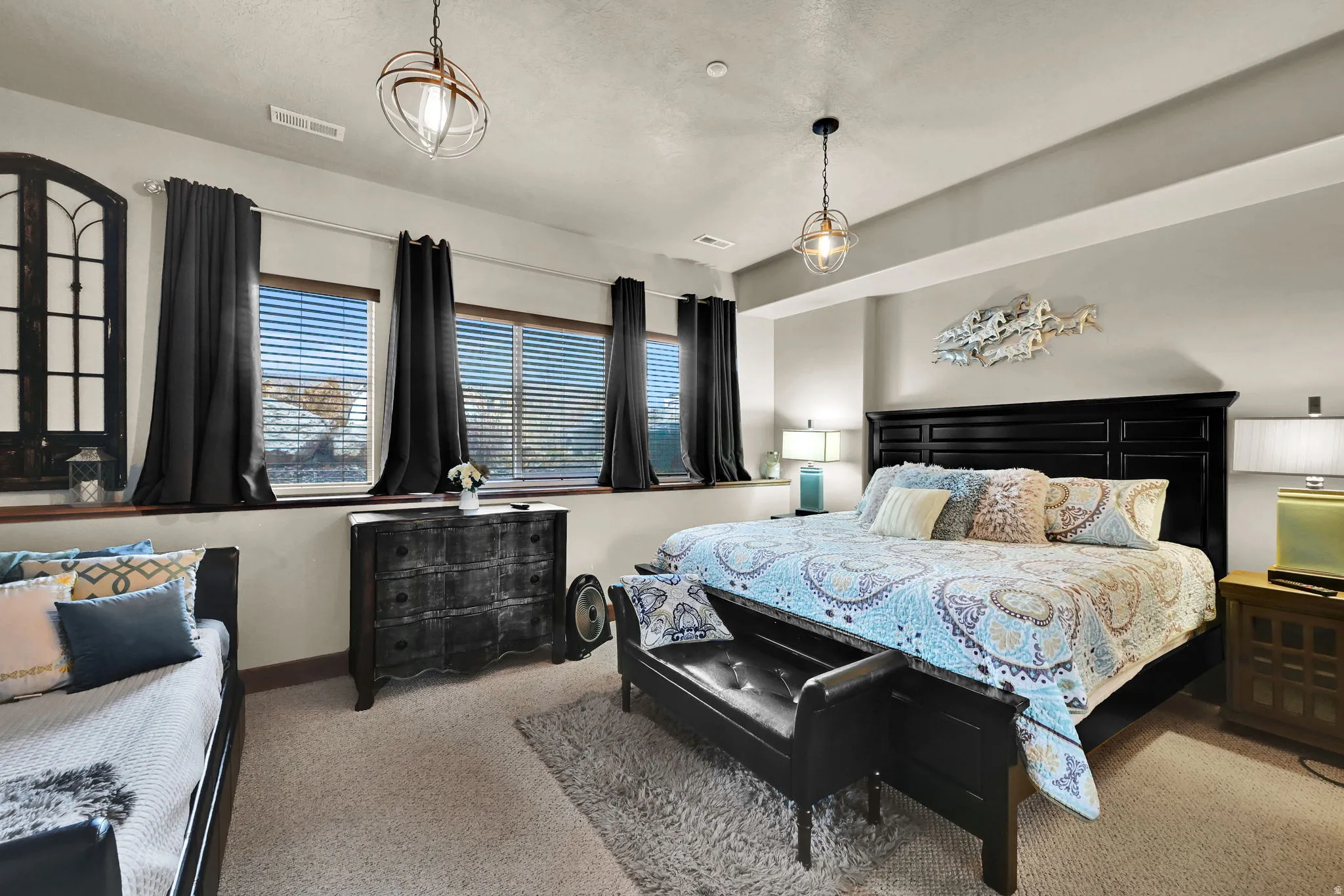 Carpeted bedroom featuring baseboards