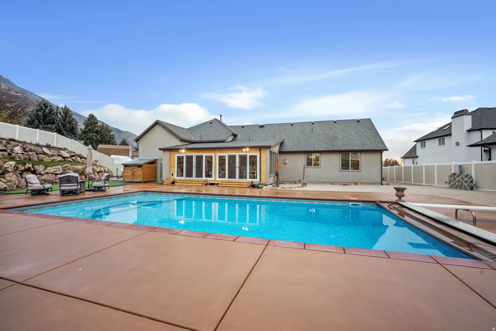 View of swimming pool featuring a fenced backyard and a patio