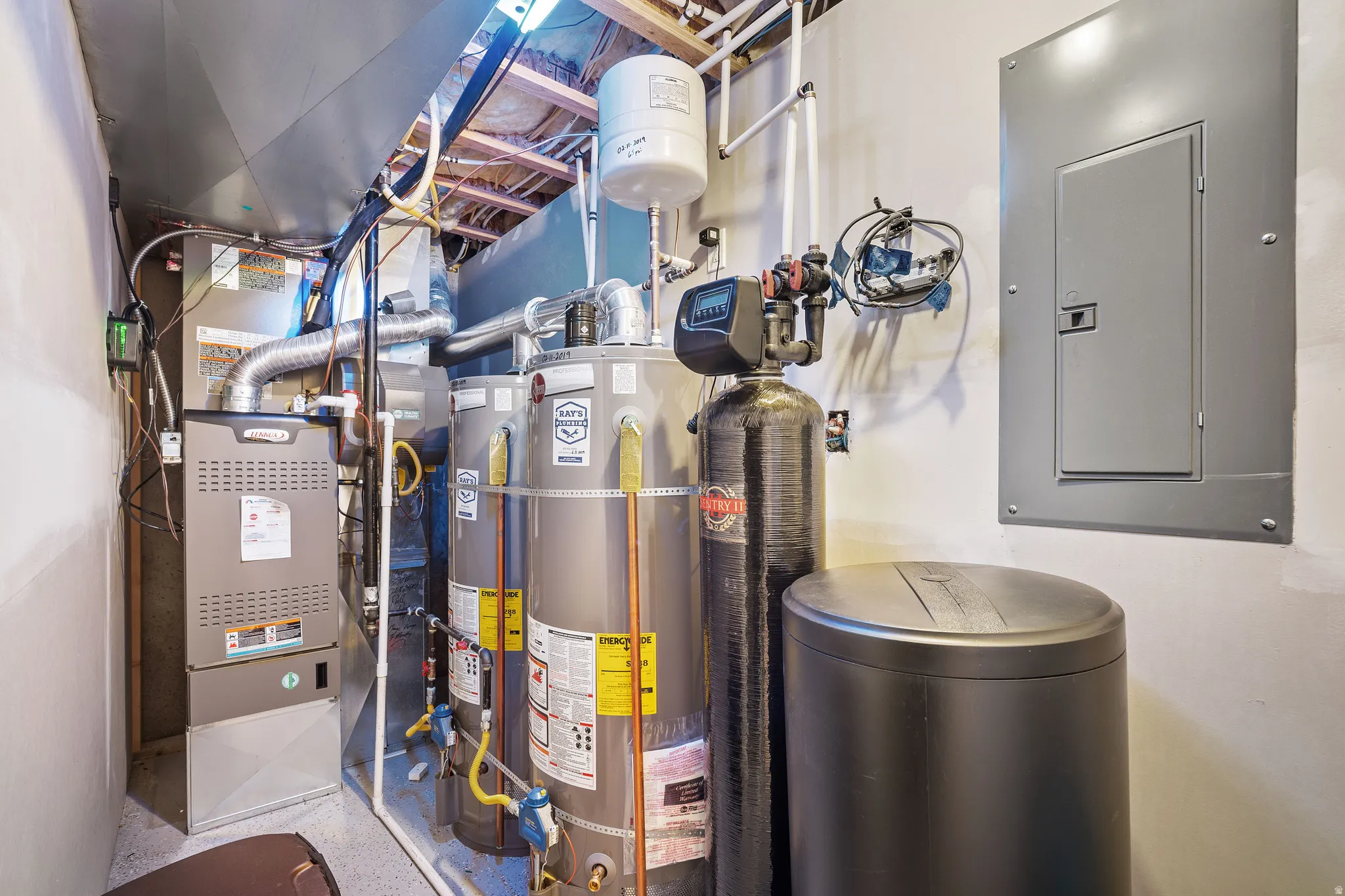 Utilities with electric panel, secured water heater, gas water heater, and heating unit