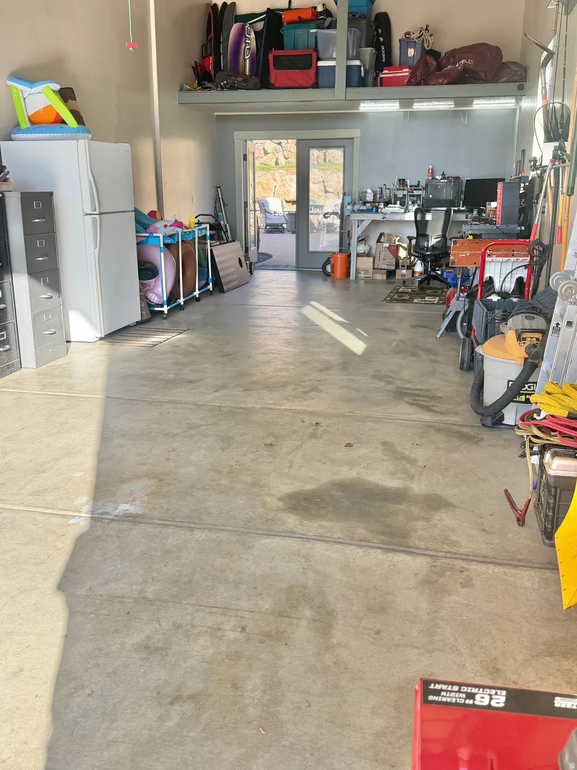 Garage with freestanding refrigerator