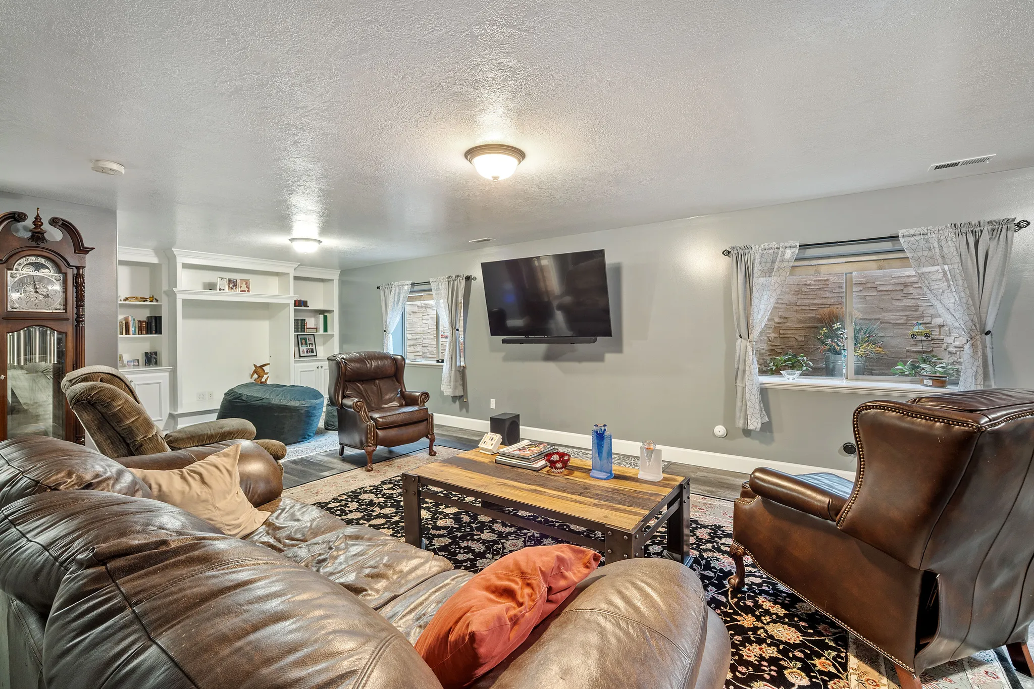 Living area with a textured ceiling and wood finished floors