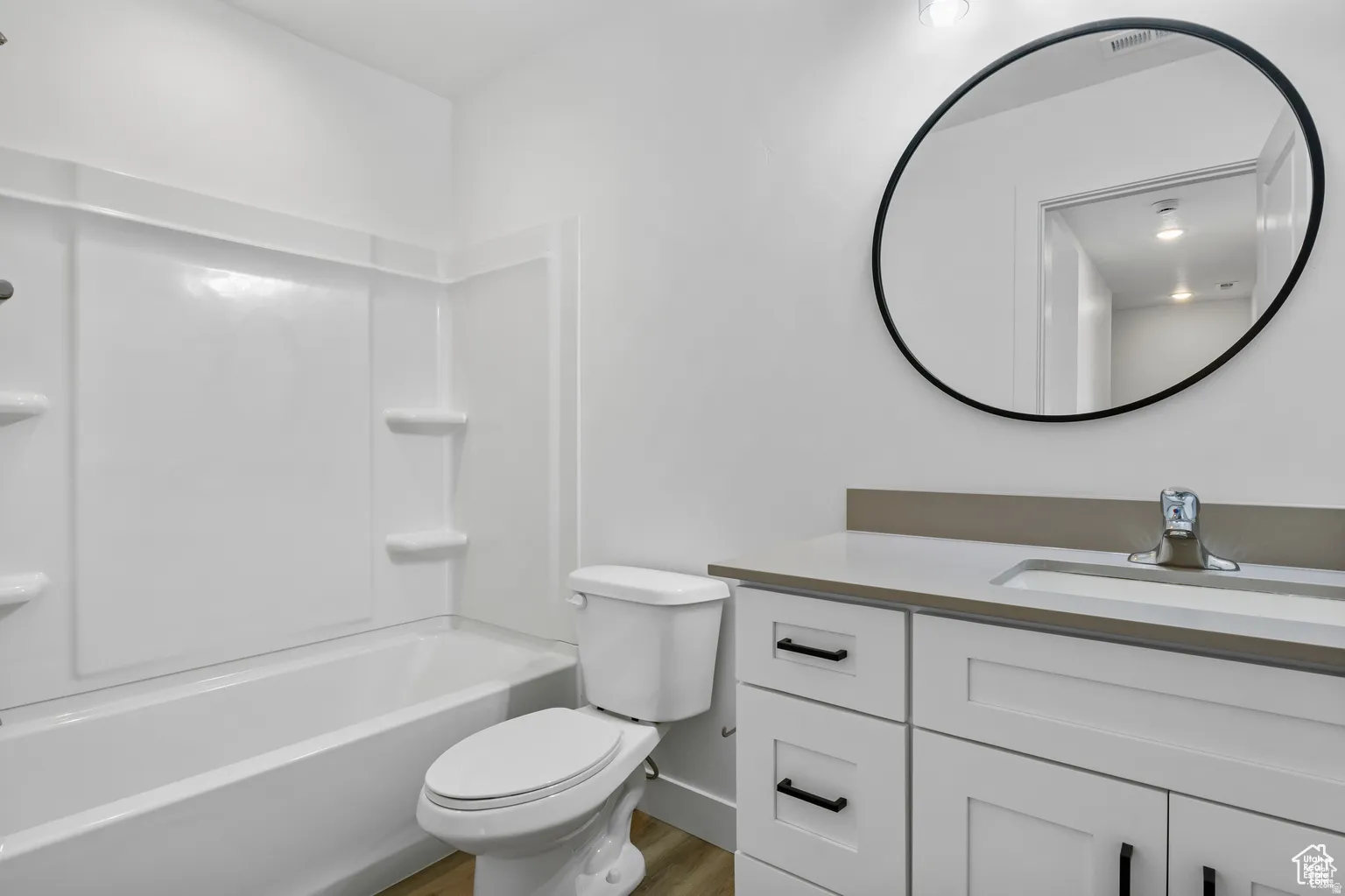Bathroom featuring shower / bath combination and vanity