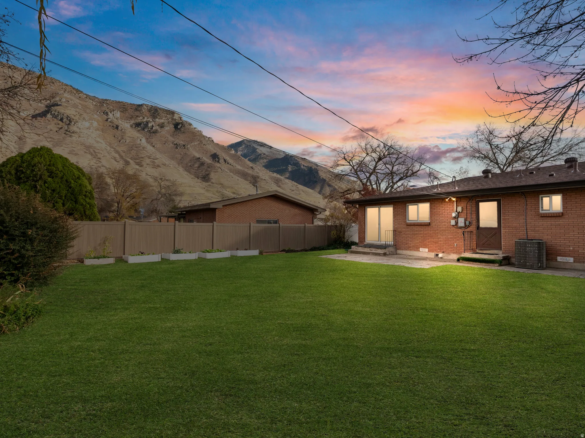 View of yard with entry steps and a mountain view