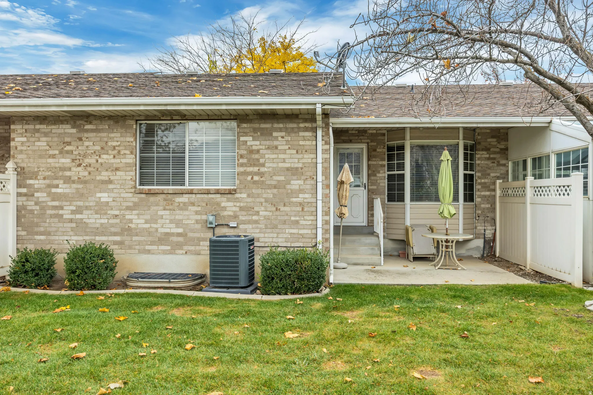 Back of property featuring a patio and entry steps