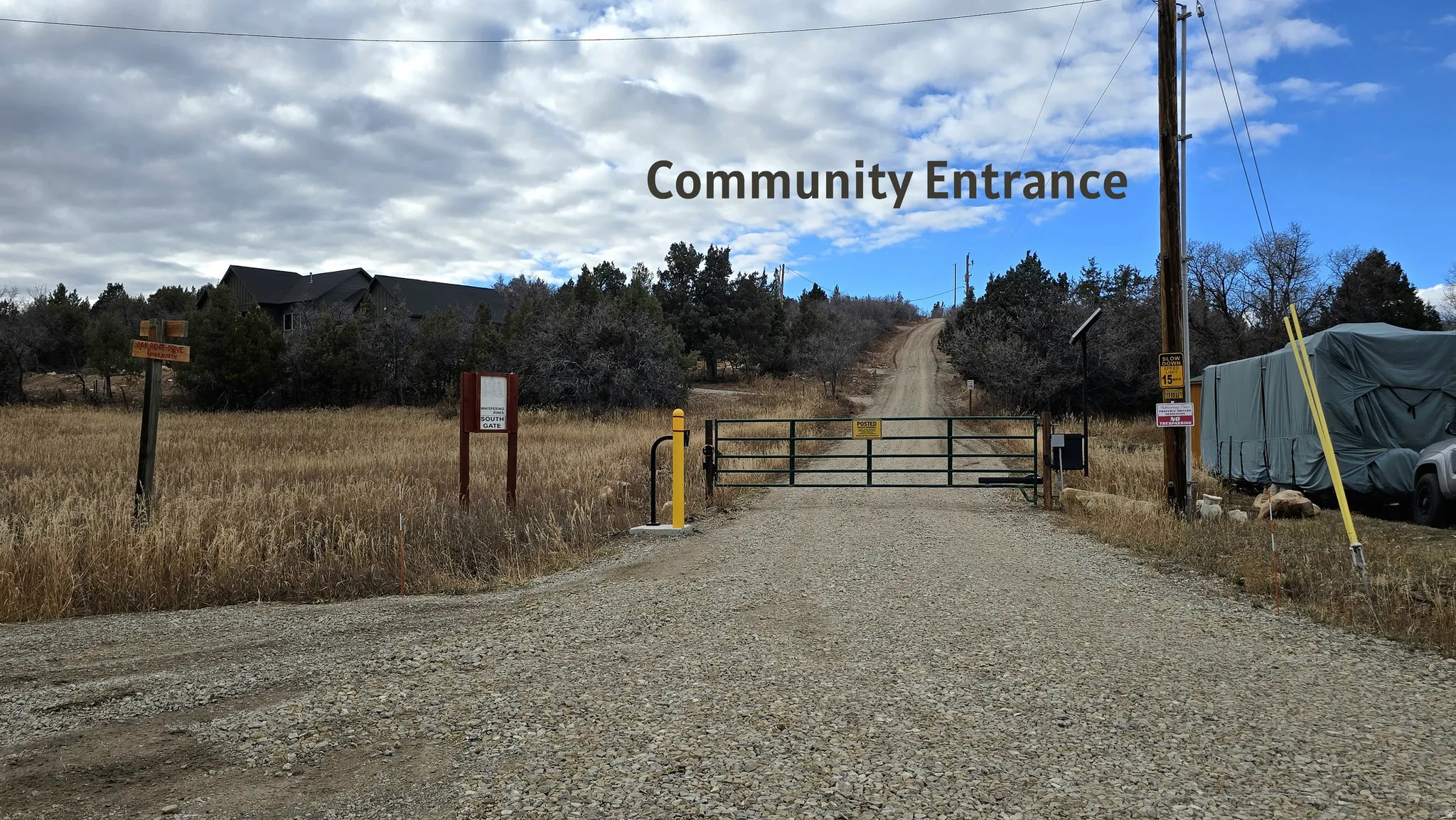 View of road with a gate and a gated entry