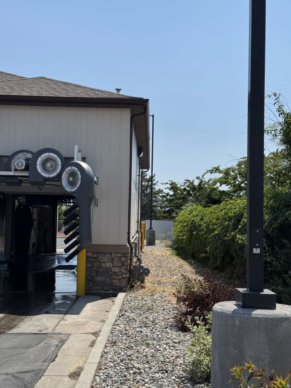 View of home's exterior with roof with shingles
