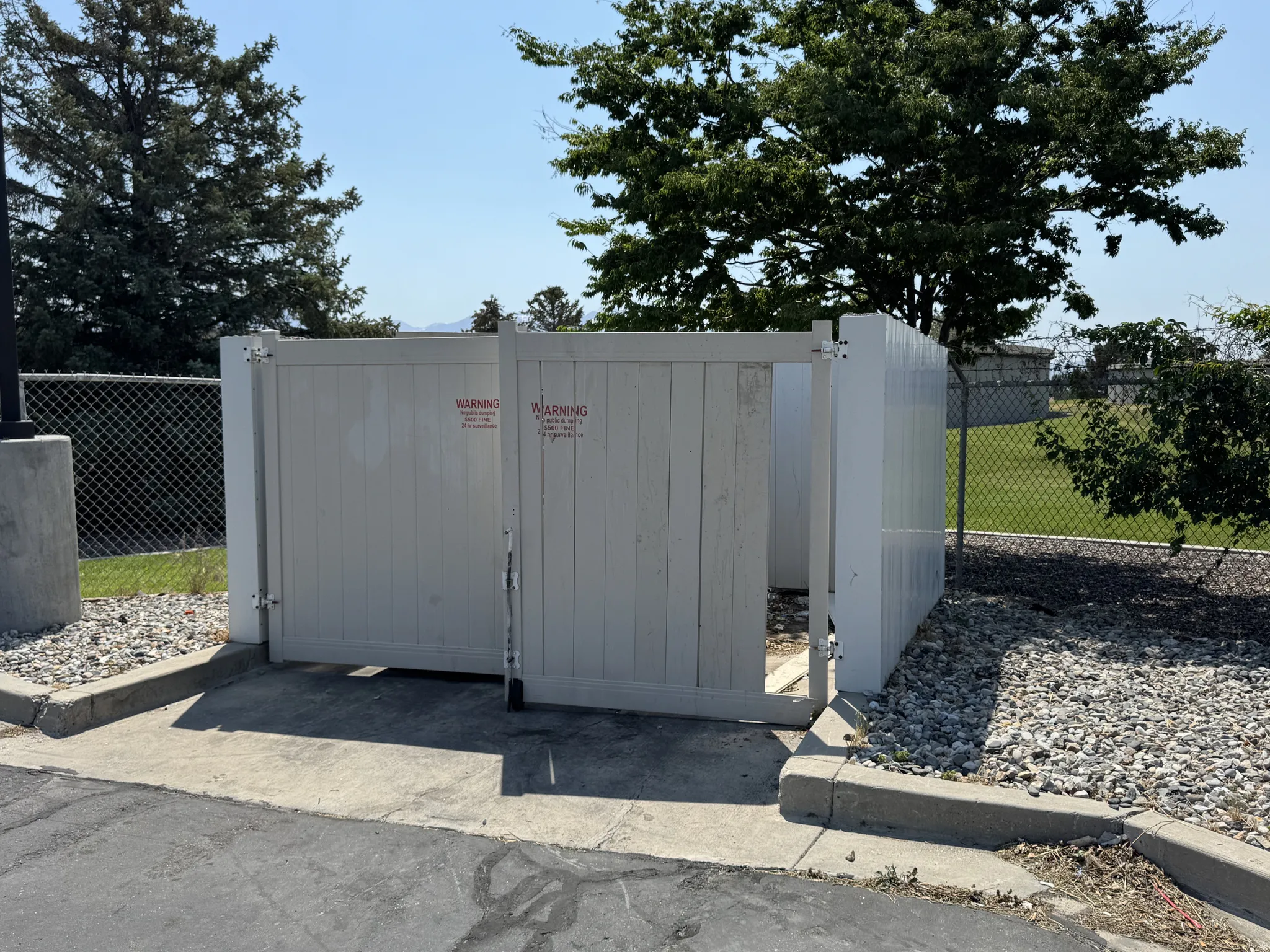 View of outbuilding featuring a gate