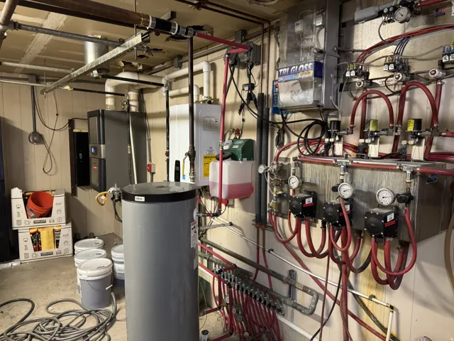 Utility room featuring water heater