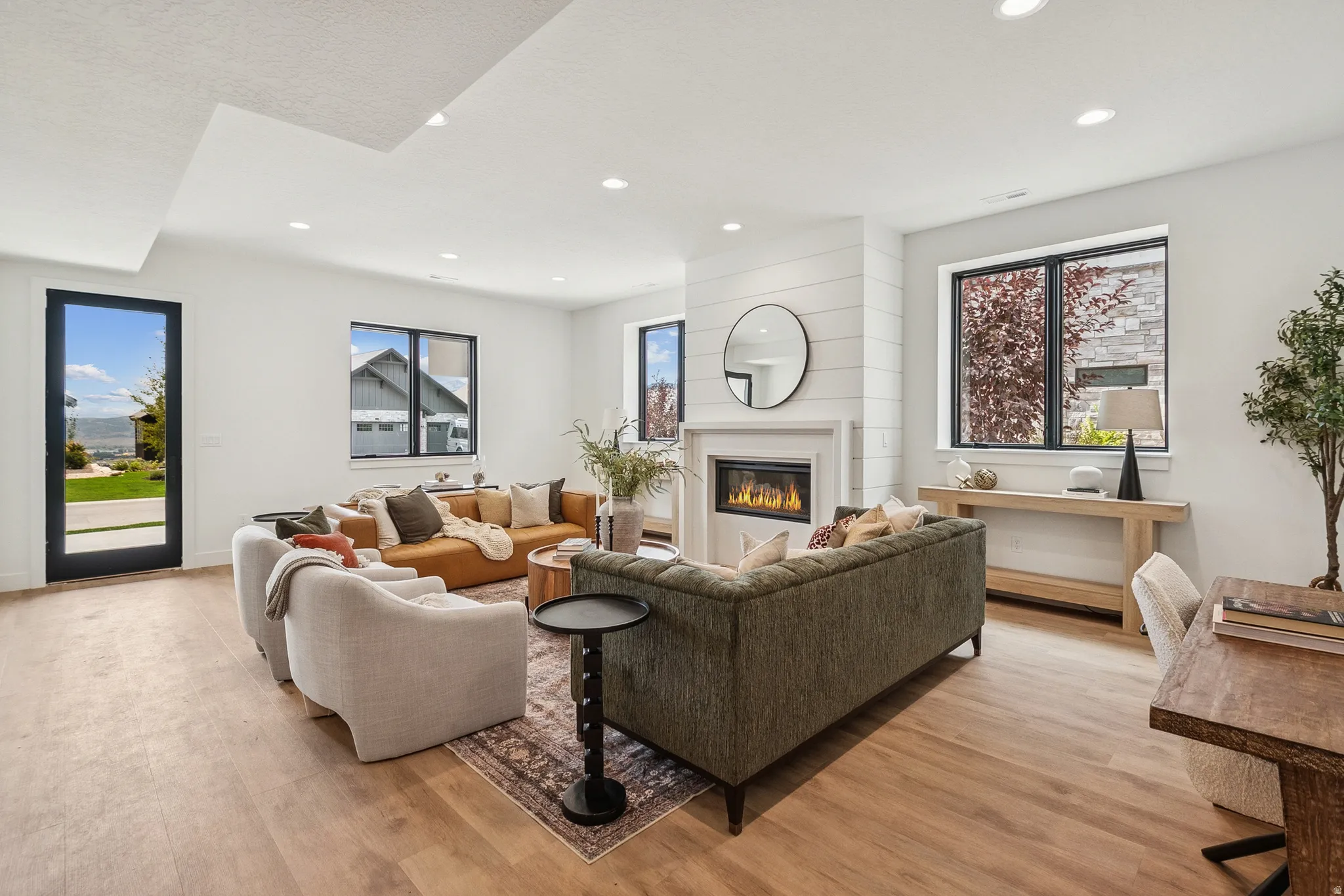 Main level entrance into a cozy family room with gas fireplace, 3 bedrooms, 2.5 baths, mudroom/laundry and direct garage access.