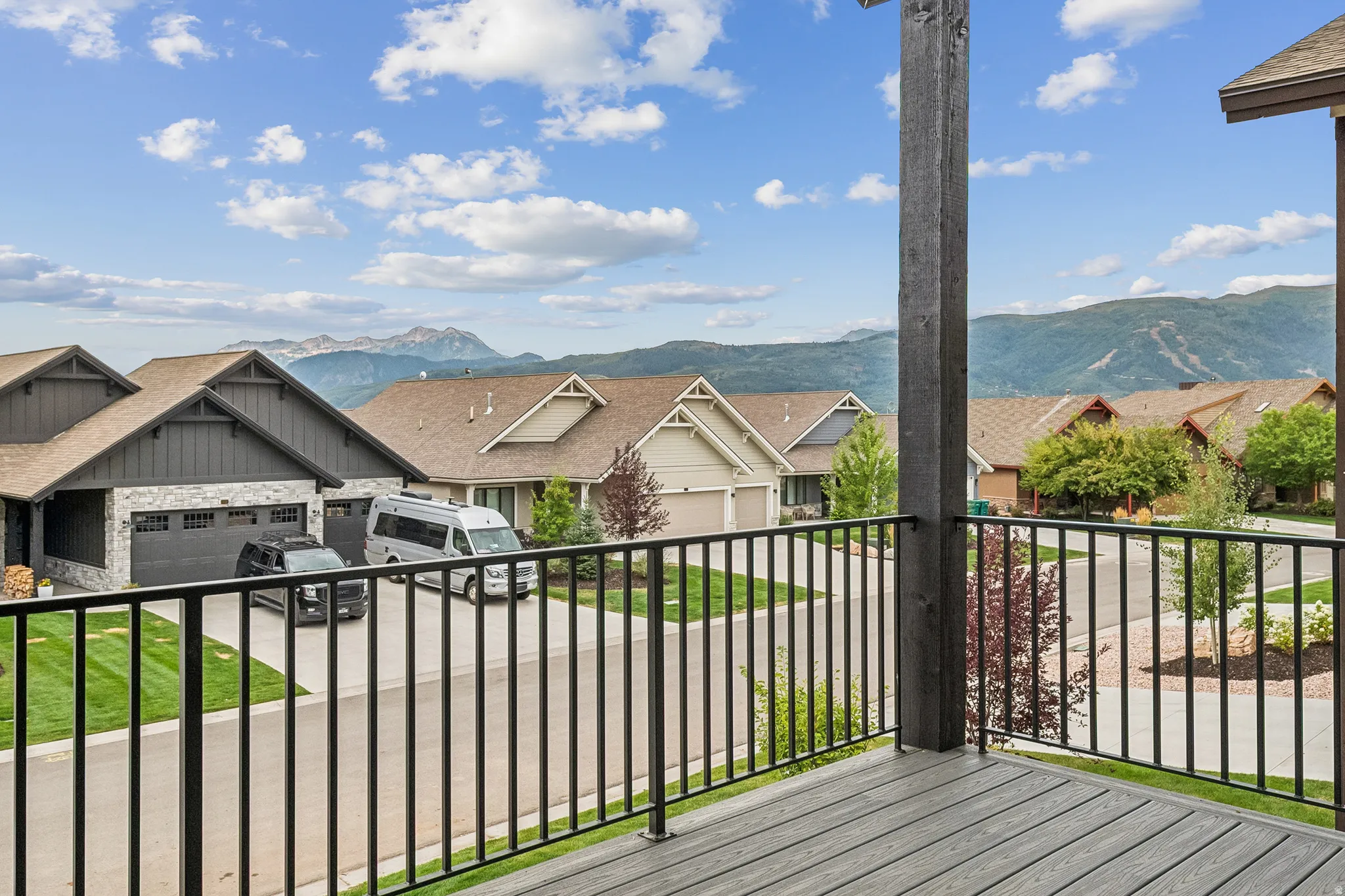 Deck featuring a mountain and valley view